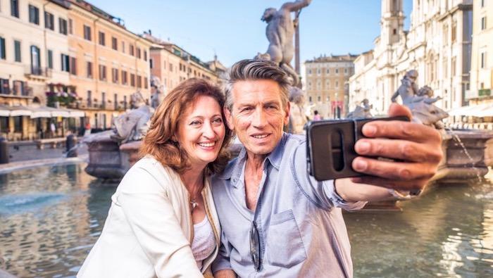 Senior Travel Italy - Older adults travellers taking a selfie in Italy