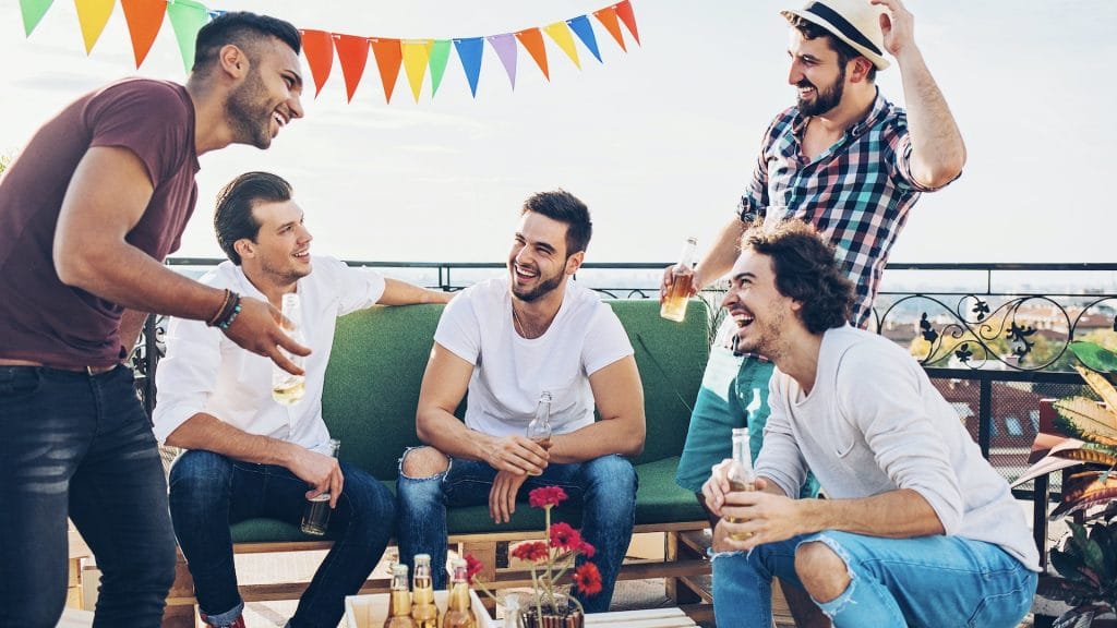 Bachelor Party Trip - Group of young men drinking and laughing - Total Advantage Destination Weddings