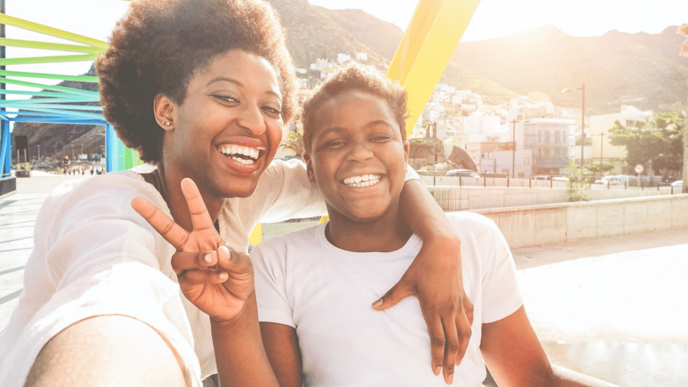 Family-Friendly Vacation - Happy Mother and Child Taking a Selfie - It's All About Family