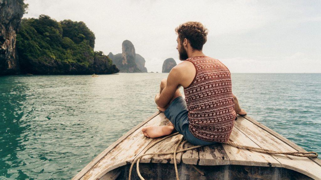 Experience Travel Blog - Total Advantage - Man Sitting on Boat